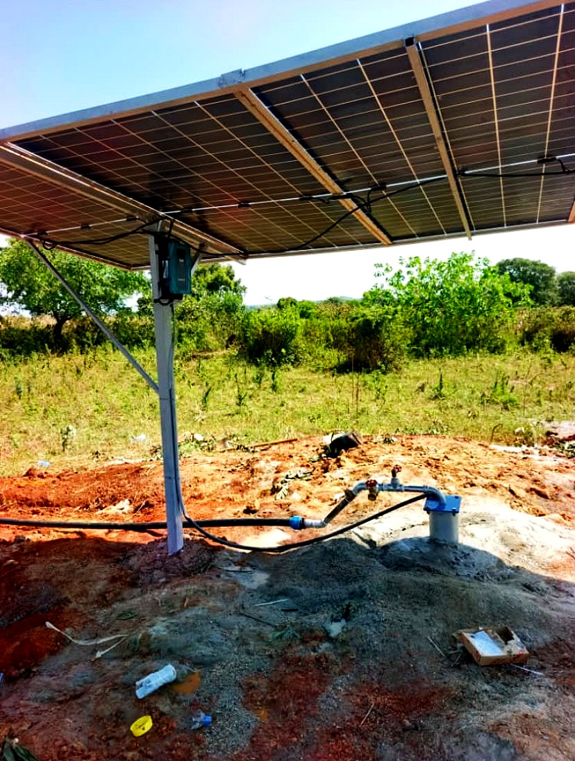 A pump controller fixed under solar panels at a borehole