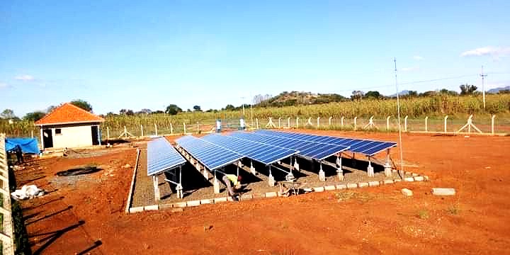 A large ground-mounted solar array being built on a farm