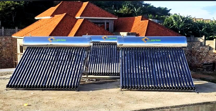 Three evacuated tube solar water heaters on a rooftop